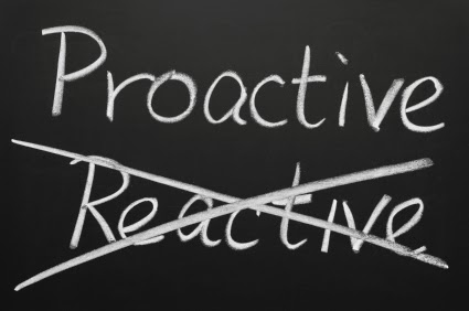 Chalk writing of 'Proactive' above crossed out 'Reactive'