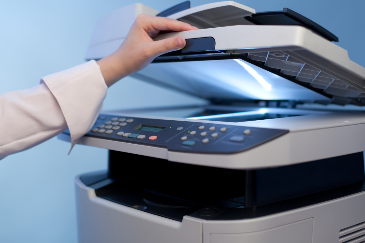 A person operating a printer