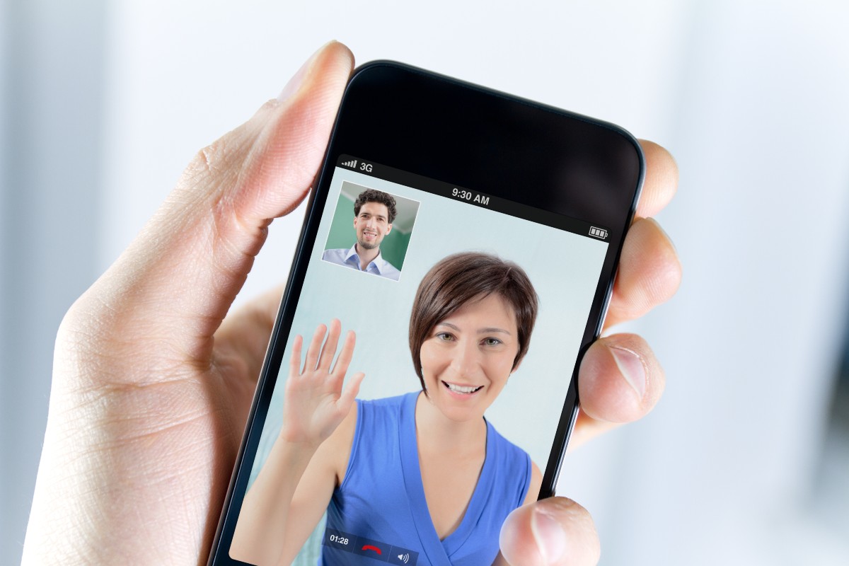 A person on a mobile phone in a video call.