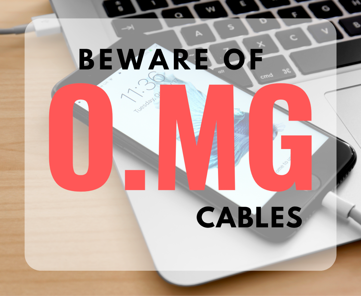A cellphone resting on a laptop in the background and a text overlay stating 'Beware of O.MG Cables'
