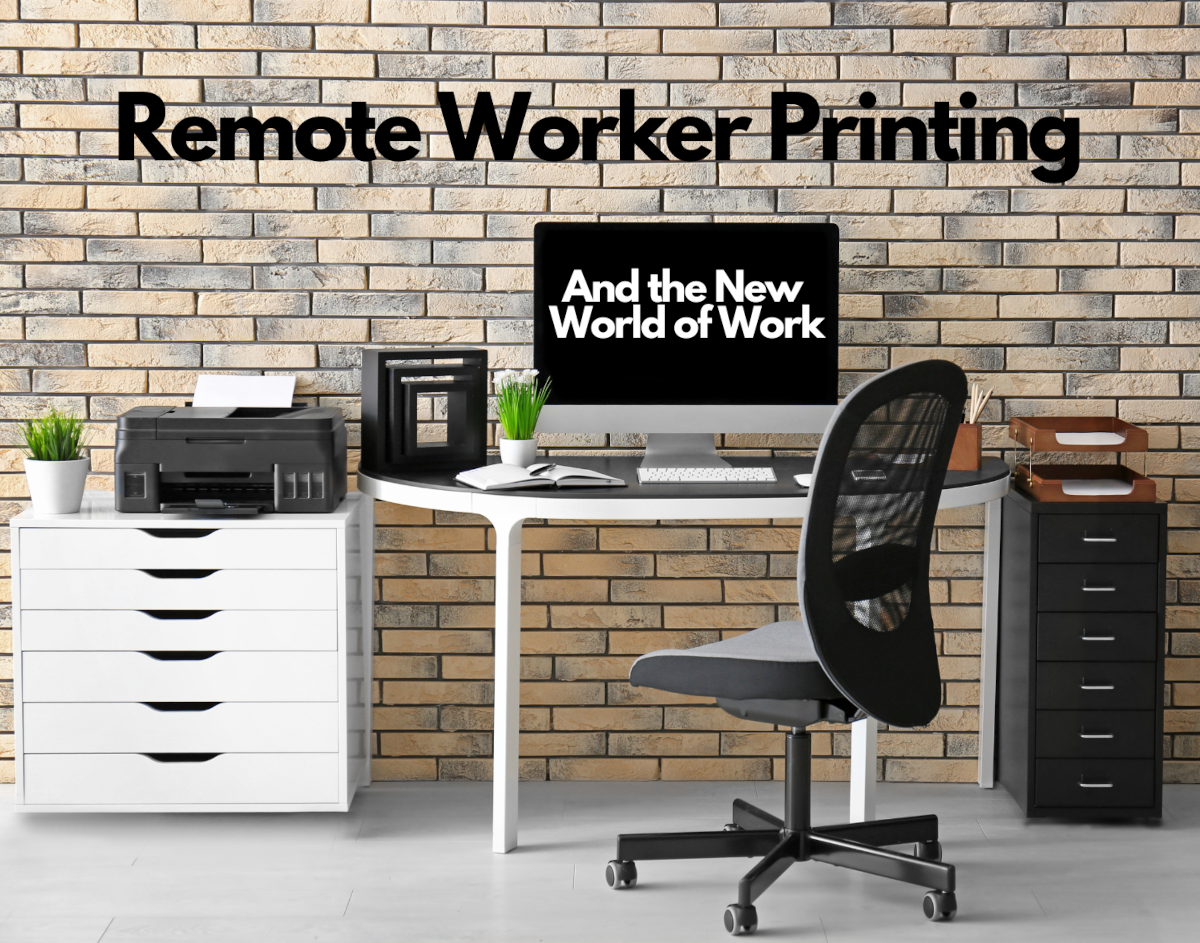 A modern desk setup with the words 'Remote Worker Printing' on the wall and 'And the New World of Work' on the computer screen