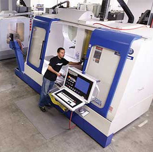 Man standing in front of industrial printing machine